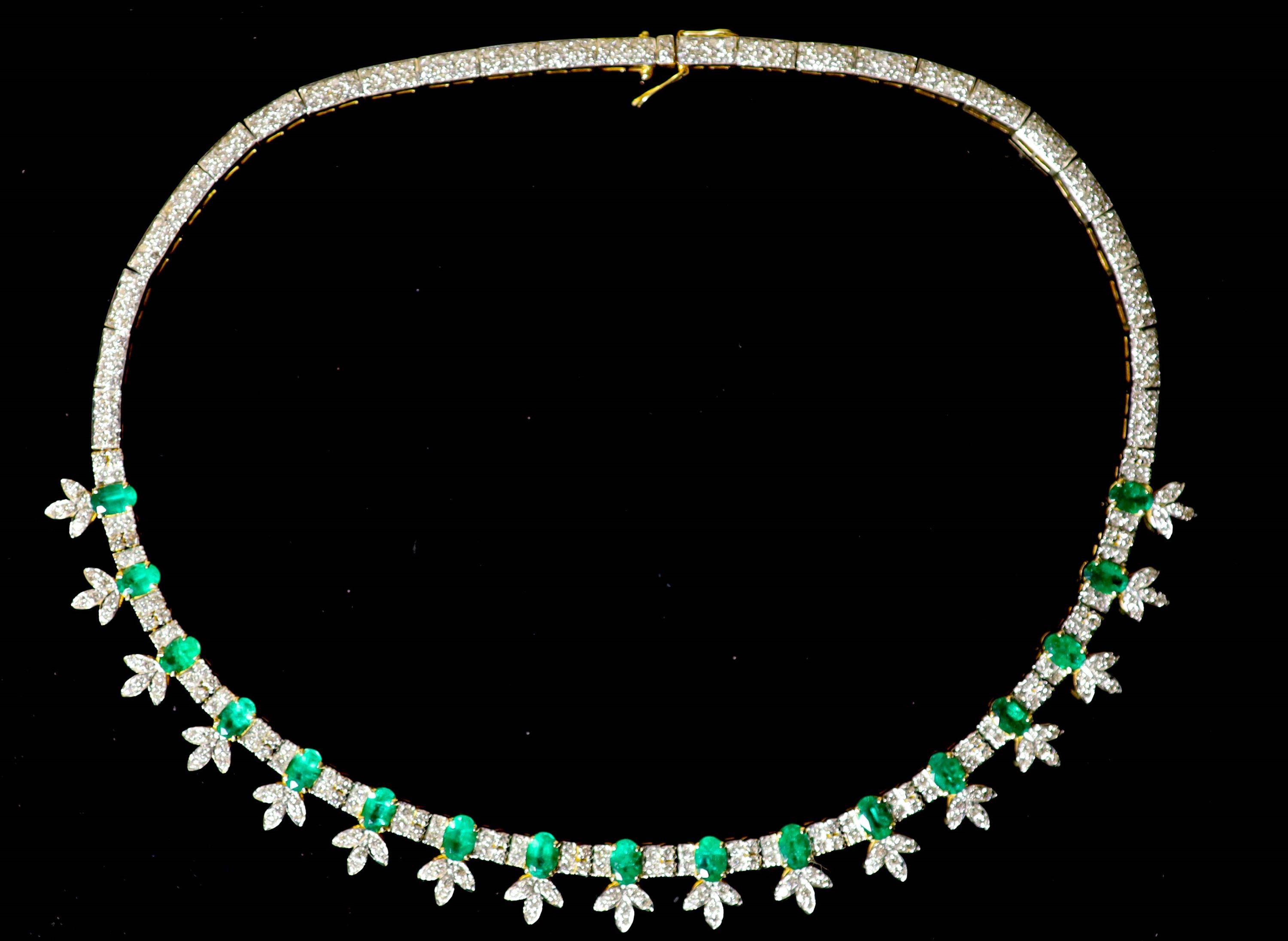 An attractive modern 18k gold, emerald and diamond cluster set choker necklace,